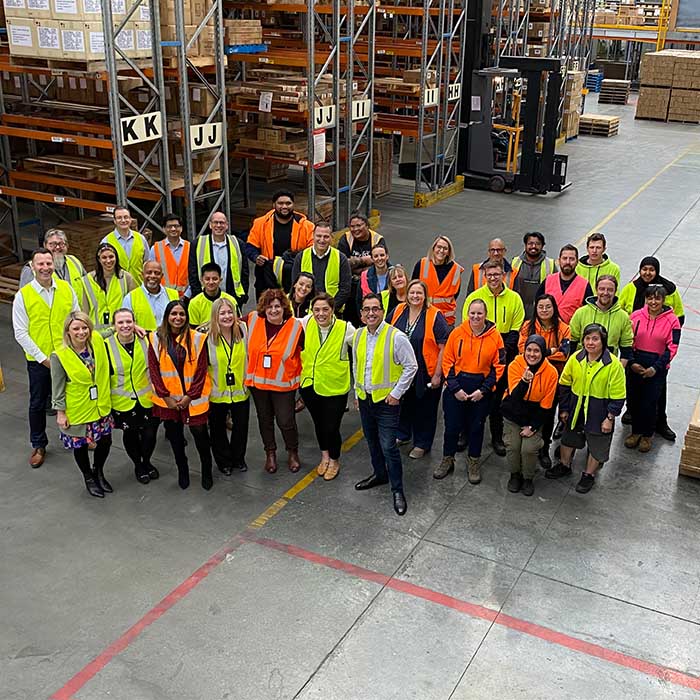Australian employees in a group together.